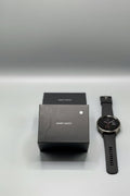 Black smart watch box on a gray background